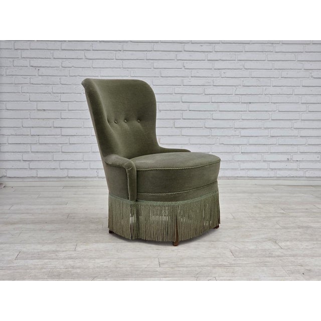 1970s, Danish armchair. Original green furniture velour, beech wood legs, brass in the seat. Original good condition: no...