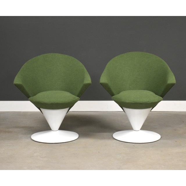 A pair of mid century modern white cone swivel lounge chairs with new green tweed fabric designed by Adrian Pearsall for...