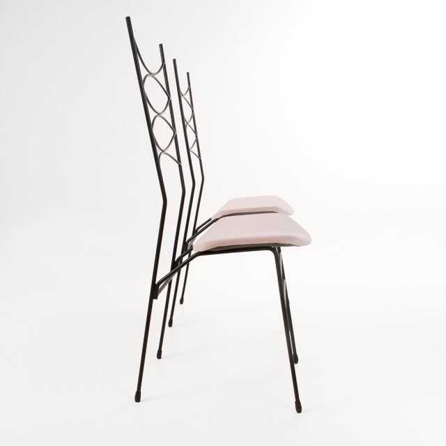 Pair of French-made chairs from the 1950s, with powder pink velvet seats. Sturdy and sturdy, with a matte black painted...