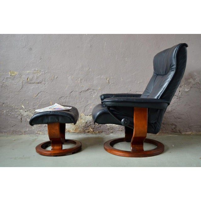 This Scandinavian lounge chair is a comfortable invitation to relax and relaxation times. The armchair and the Ottoman are...