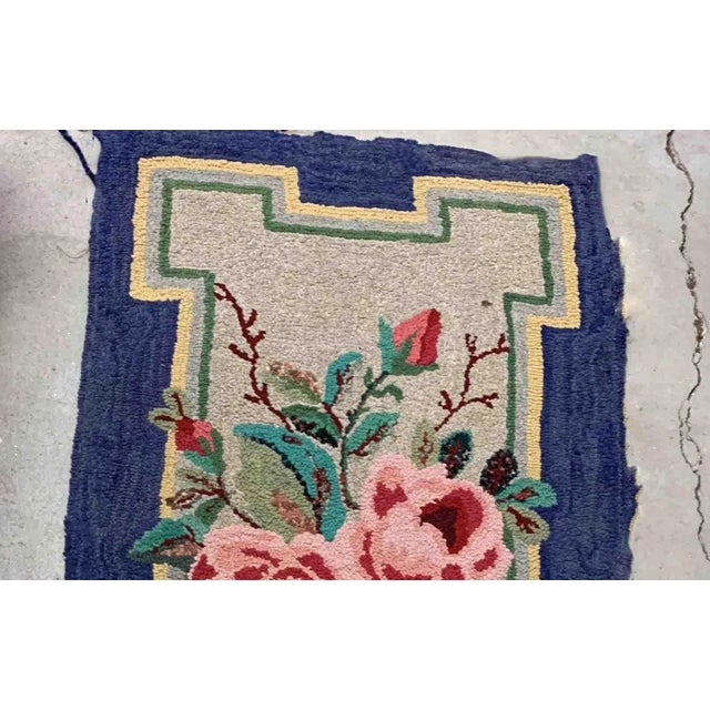 Handmade antique American Hooked rug in beige and purple shades. The rug is from the beginning of 20th century in good...