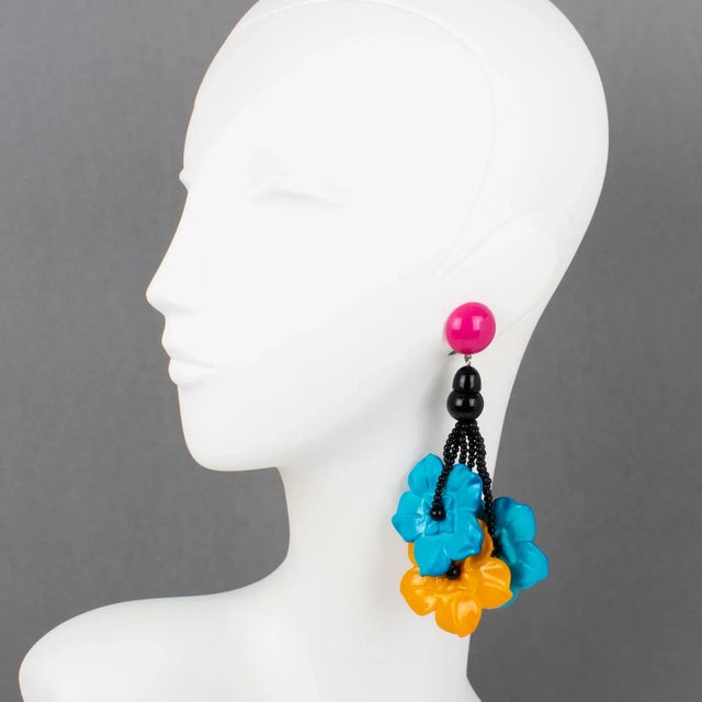 These stunning Angela Caputi, made-in-Italy resin clip-on earrings boast an oversized dangling-drop design with floral...