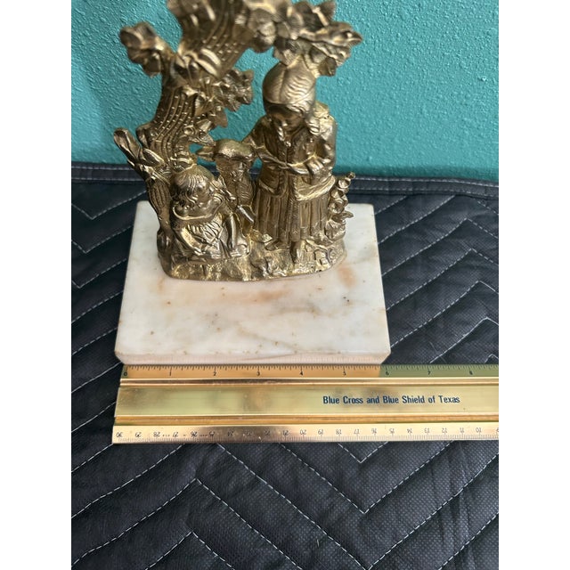 Exceptional late-19th-century Victorian brass figural girandole candelabra, dating approximately 1850-1870 mounted on a...