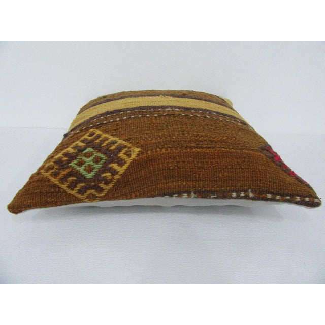 Handmade decorative pillow cover made from a vintage Turkish kilim rug. Backed with good quality cotton fabric. Pillow...