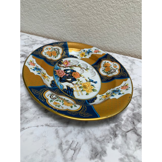 Made in England, this vintage Asian chinoiserie serving and decor tray is rich in color and floral patterns in deep gold,...