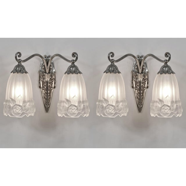 Paul Gilles A pair of French art deco double wall sconces by Paul Gilles. Done in nickel plated bronze or solid brass and...