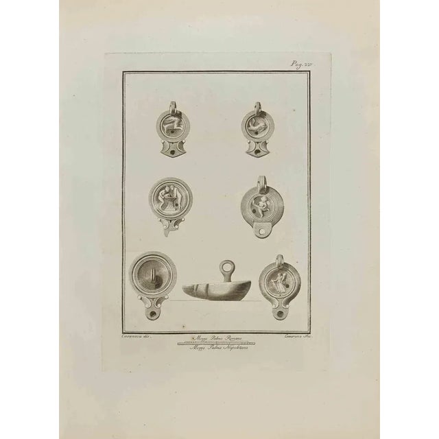 Still Life from "Antiquities of Herculaneum" is an etching on paper realized by Nicolo Cesarano in the 18th Century....