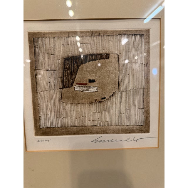 Abstract Print Signed. We are unable to identify the artist or the title of the piece. The print features browns, black...
