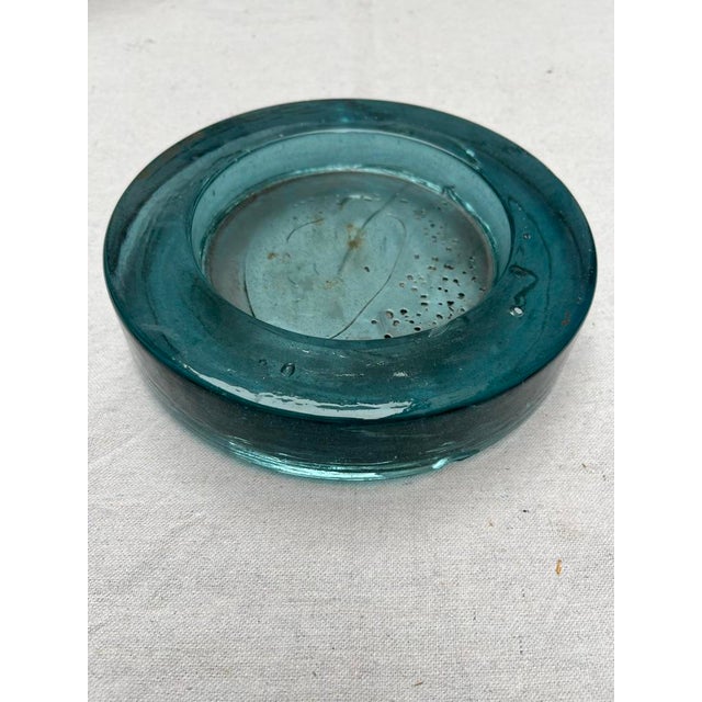 A single vintage round blue green art glass vessel or ashtray. 6" interior base.