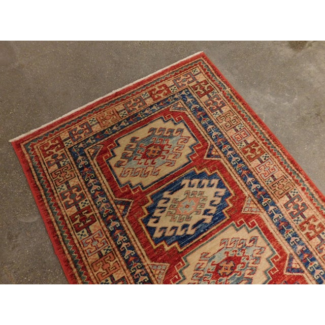 Origin: Hand made in Pakistan Design: Multi geometric medallion in multiple colours. Dimension: 2'4"x 8' Age: 20 years...