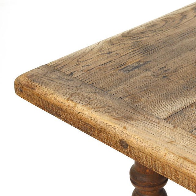 A beautiful, large country-style dining table made of solid oak, traditionally crafted with mortise-and-tenon joints. The...
