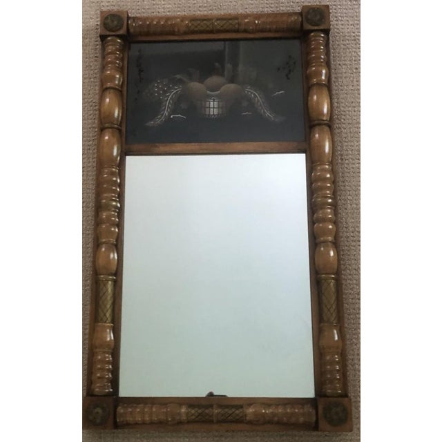 This vintage Hitchcock wall mirror in Federal style features a stenciled top panel (eglomise) depicting a basket of eggs,...
