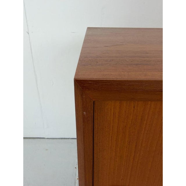 Midcentury sideboard designed and manufactured by Danish maker Clausen & Søn in 1960s Denmark. This simple yet...