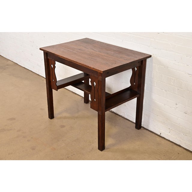 A gorgeous antique Mission oak Arts & Crafts writing desk or library table with built-in bookcases In the manner of...