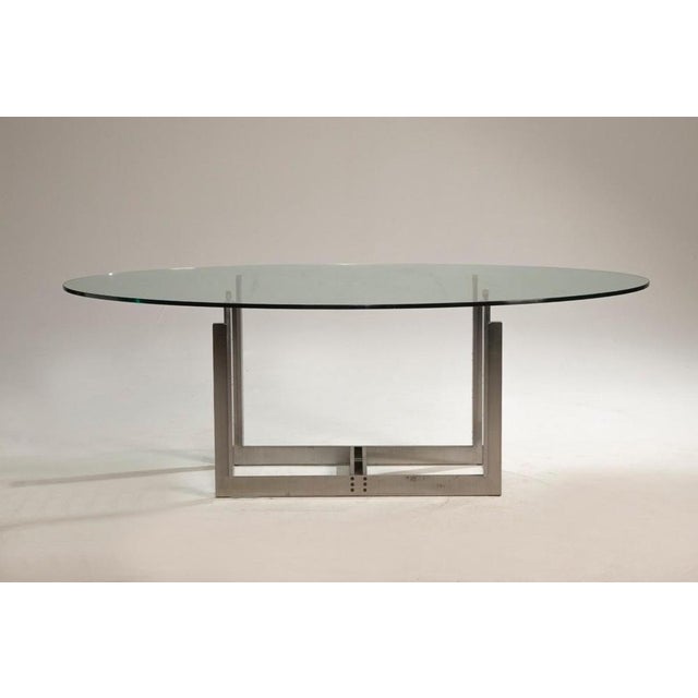 The Sarpi table, designed by Carlo Scarpa for Simon by Cassina, features a satin-finished extruded metal structure with a...