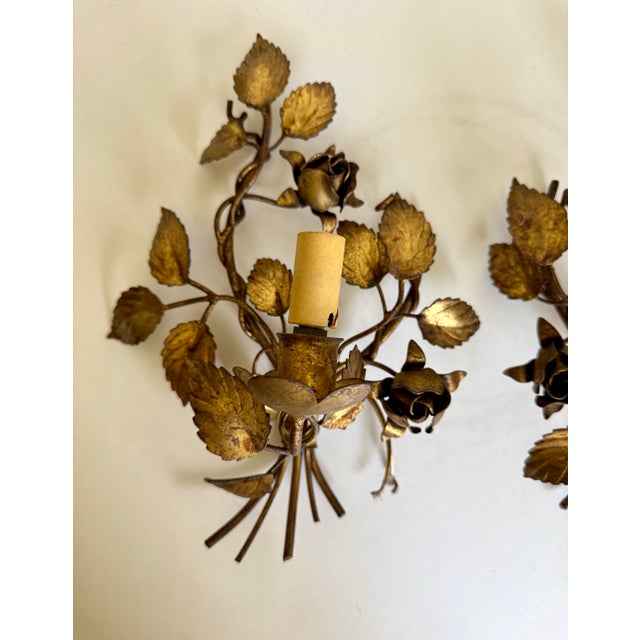 This lovely pair of Hollywood Regency inspired vintage Italian Florentine gilt metal rose wall sconces dates to the...