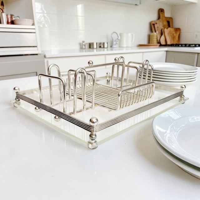 Elevate your dining experience with the 1970 American Mid-Century Modern Silver Plate Lucite Buffet Caddy, a stunning...