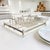 Elevate your dining experience with the 1970 American Mid-Century Modern Silver Plate Lucite Buffet Caddy, a stunning...