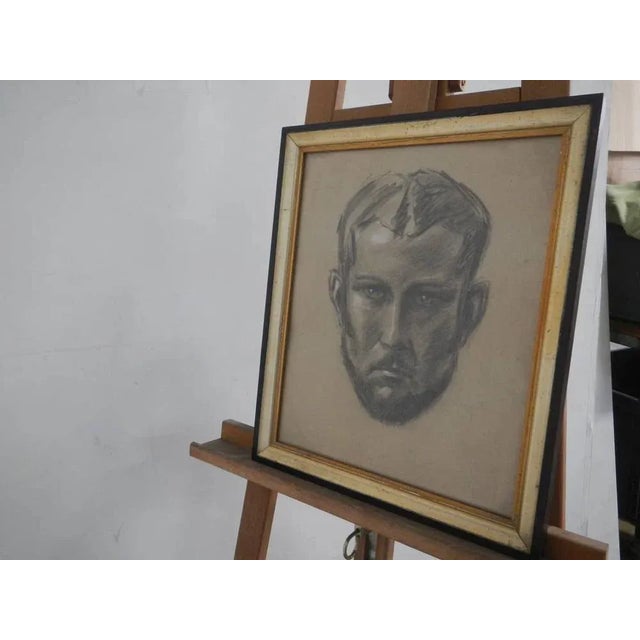 Charcoal with man's face on paper with painter's signature and date of creation. Certificate of guarantee of the work.Made...