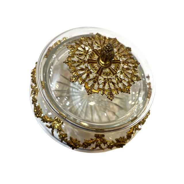 A beautiful French crystal jar with ornate ormolu mounts dating to circa 1890. The clear crystal body is complemented by...