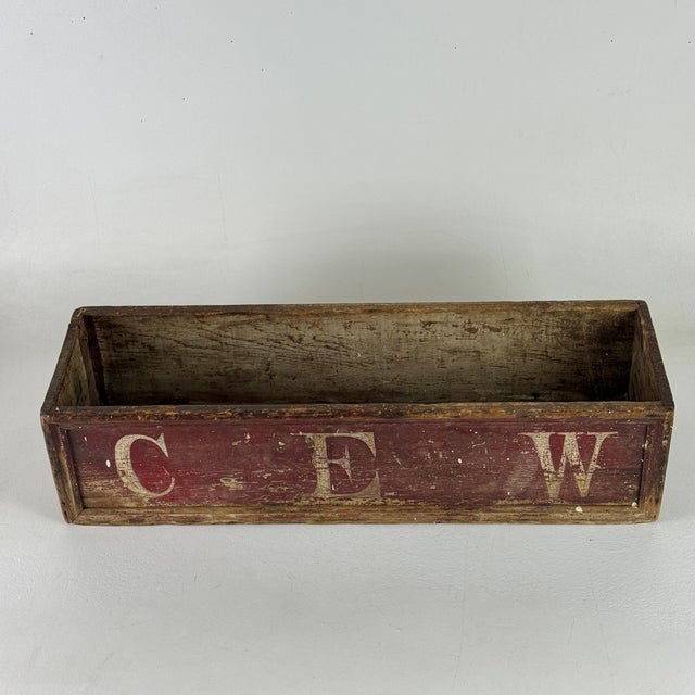A delightful primitive utilitarian trough/box turned Objet d'Art. Though unclear of its original use, this cheerful box...