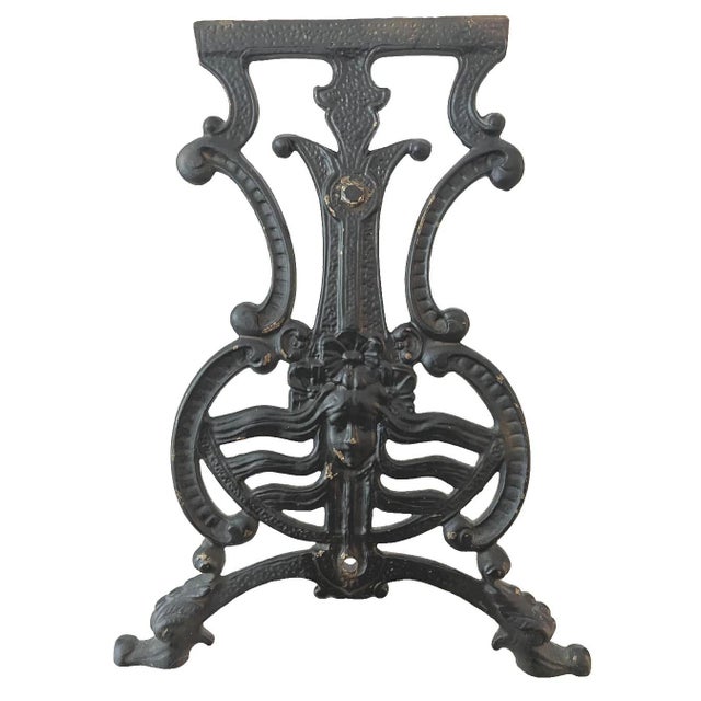 This is an original Art Nouveau bench in the classic style featuring a maiden with flowing hair. The cast iron shows age...