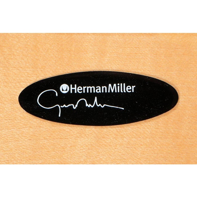 An iconic pair of slat wood benches designed by George Nelson for Herman Miller, representing one of the most enduring and...