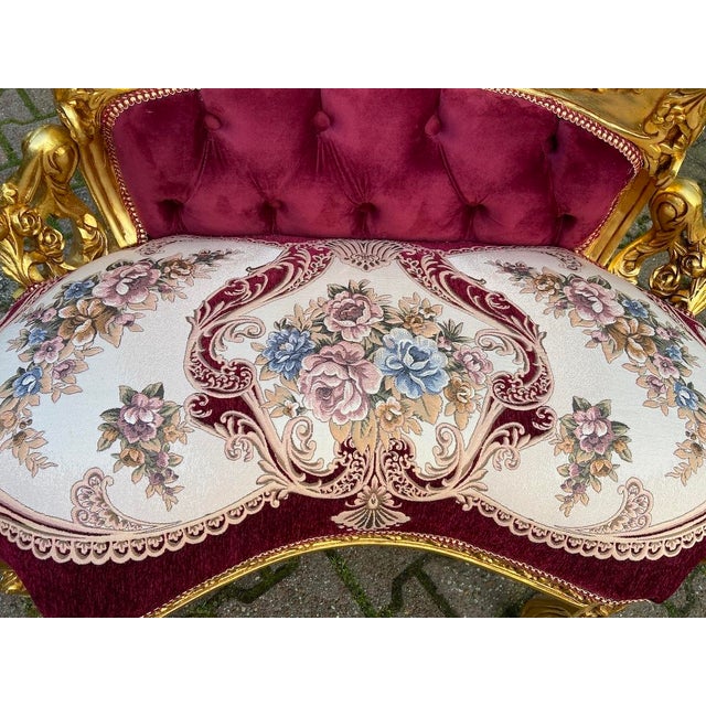 This elegant late 20th-century French Louis XVI–style settee combines refined neoclassical design with a rich antique-gold...