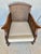 This Early 20th Century French Style Lounge Chair was crafted in the early 1900's from walnut and cane. The armchair...