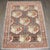 A scattter size Persian Senneh Rug with a "gol farang" floral design