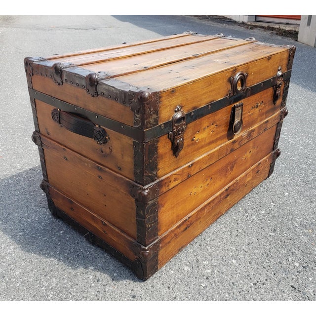 Early 20th Century American pine Blanket Trunk. Textile lined interior. Functional Leather handles. Measures 33" in width,...
