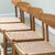 A harmonious quartet by A.M. Møbler , these Model 501 chairs embody the enduring language of Mid-Century Danish design...