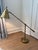 Hand rubbed antique brass table lamp featuring a single screw hinge detail. An attractive brass shade completes the look....