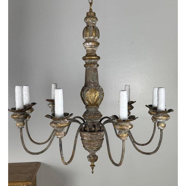 An elegant and finely proportioned Italian chandelier dating to the late 19th century, carved in wood and gesso with...