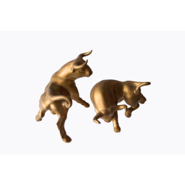 Midcentury pair of matte gold metallic ceramic fighting bulls. These are in good condition. Some chips, minor wear. Taller...