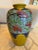 A beautiful crackled glazed vase. Depicts a tree scene with birds and grapes. This vibrant vase was made in Japan and...