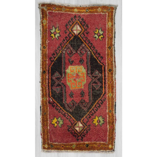Handknotted mini rug from Malatya region of Turkey. Approximately 50-60 years old. In good condition.