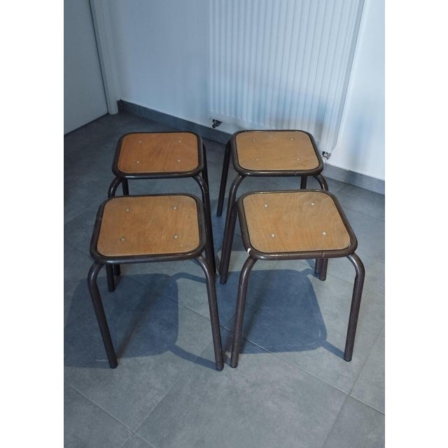 Set of 4 workshop, school, or factory stools by m u l l c a. practical and stackable. industrial style, with a distinctly...