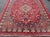 Measures: 7'8 x 11'2 Vintage Persian Isfahan Rug with Red Field and Ivory Medallion Design. Keivan Woven Arts/...