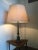 This is a vintage brass Regency/Empire style table lamp with the original shade. European Plug (up to 250V).The wiring of...