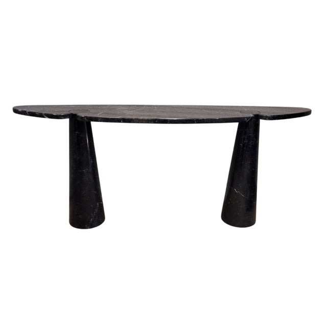 A unique and outstanding italian console table in black marquina marble, designed by angelo mangiarotti, from the "eros"...