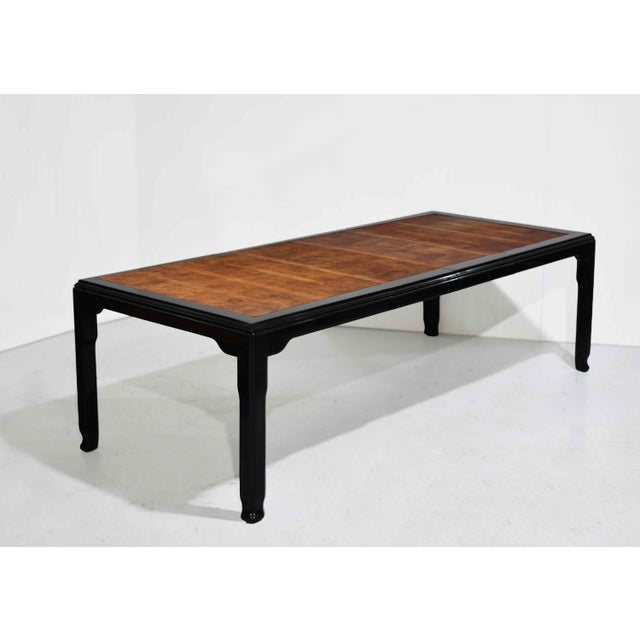 Bold, elegant, and unmistakably iconic, this mid-century modern dining table from the celebrated Chin Hua collection pairs...