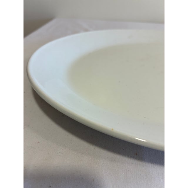 A classic vintage finds oval serving platter by Johnson Brothers of England, finished in smooth white ironstone with no...