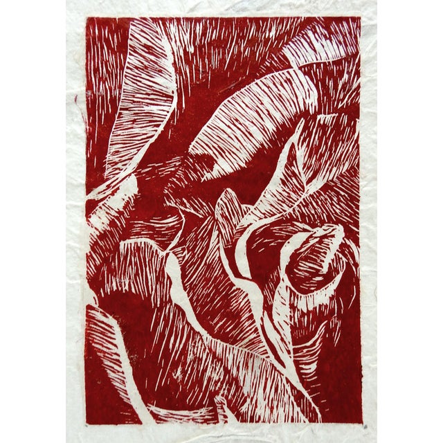 Woodcut print on handmade paper with leaves. Looks like the print was done on thin paper then pressed onto the handmade...