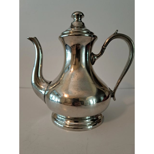WILLIAM ROBERTS PEWTER 5 PIECE TEA AND COFFEE SERVICE This exquisite 5-piece pewter coffee/tea service is designed by...