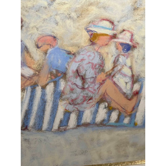 A beautiful beach scene by 20th-century painter Yves Wacheux, depicting a group of figures on the sand facing the sea, in...