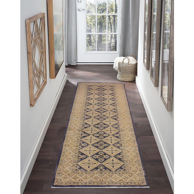 Enhance the ambiance of your home with this magnificent Persian-influenced Turkish hand-knotted rug made by skilled...