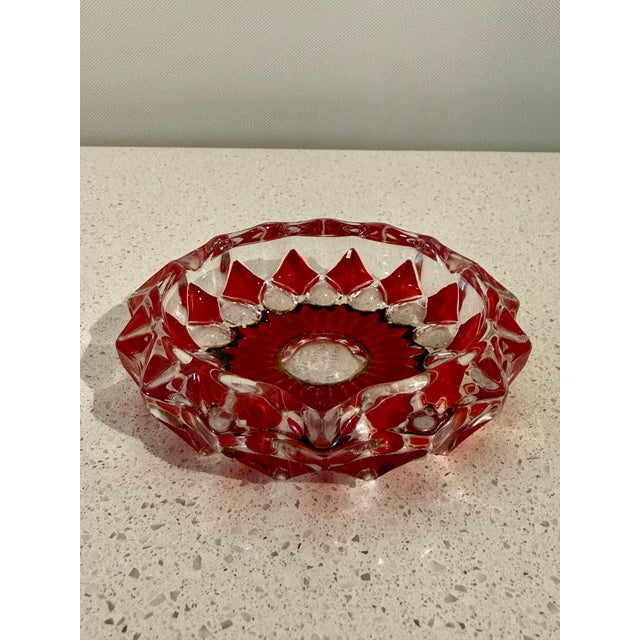 Vintage French art glass ashtray featuring bold ruby red and clear geometric floral design. The heavy molded glass...