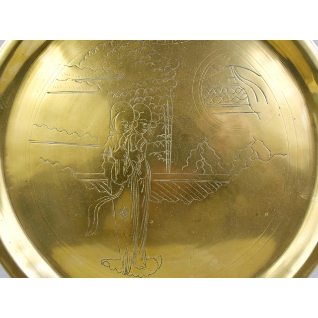 Stunning Chinese etched brass tray features a young couple engraved on the front with fine detailing. It is a great piece...