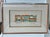 Abstract framed art tile titled “Bridge and Skyline” Silver Metal Frame measuring 19 1/2” x 13 1/2” . The inside picture...